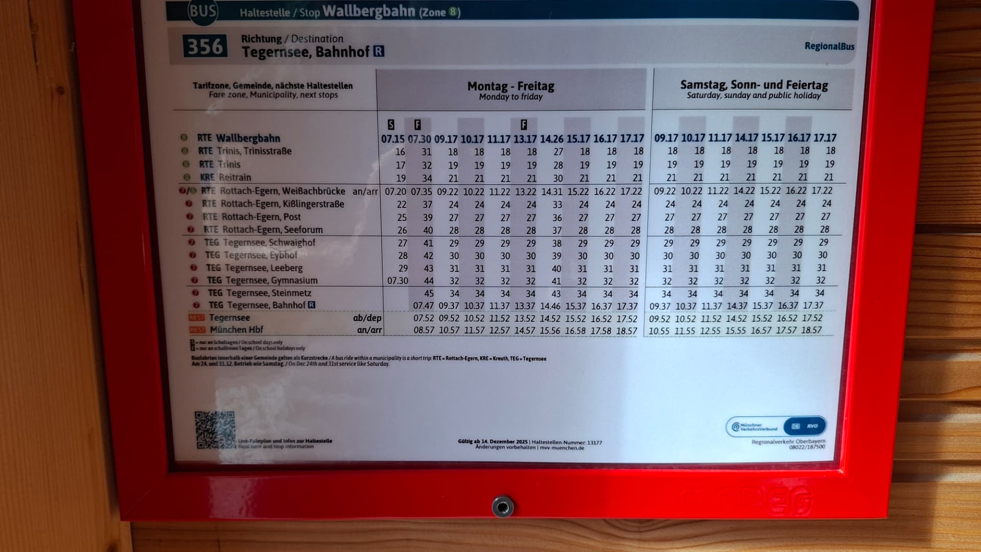 Bus/train timetable board at the Wallberg valley station stop.